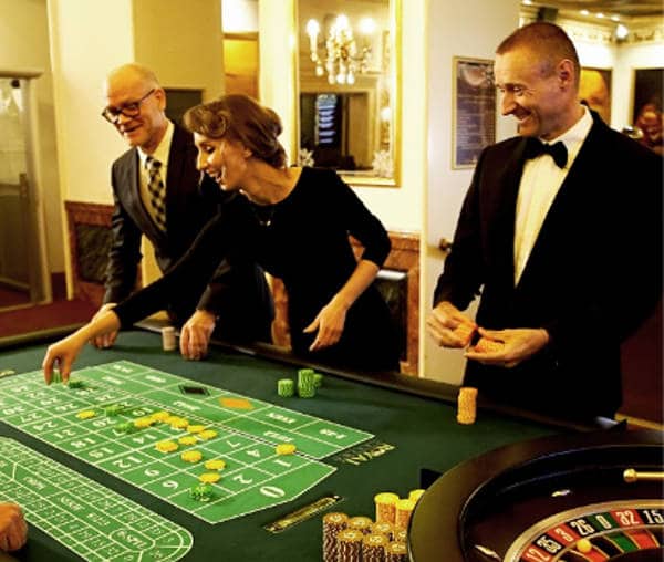 players at the table in the Royal Casino 