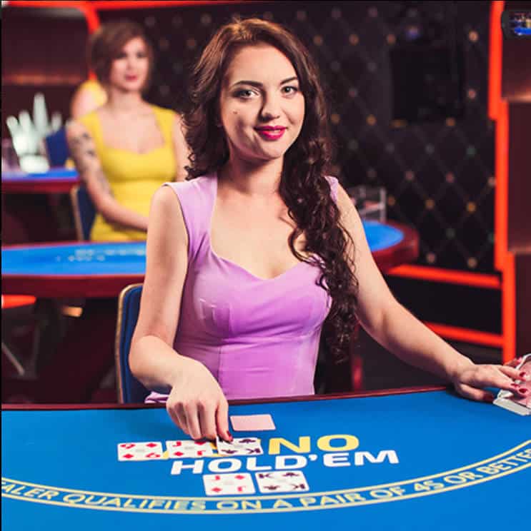 female dealer at Ezugi Live Casino Holdem table