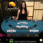 Croupier dealing a live hand of casino stud poker