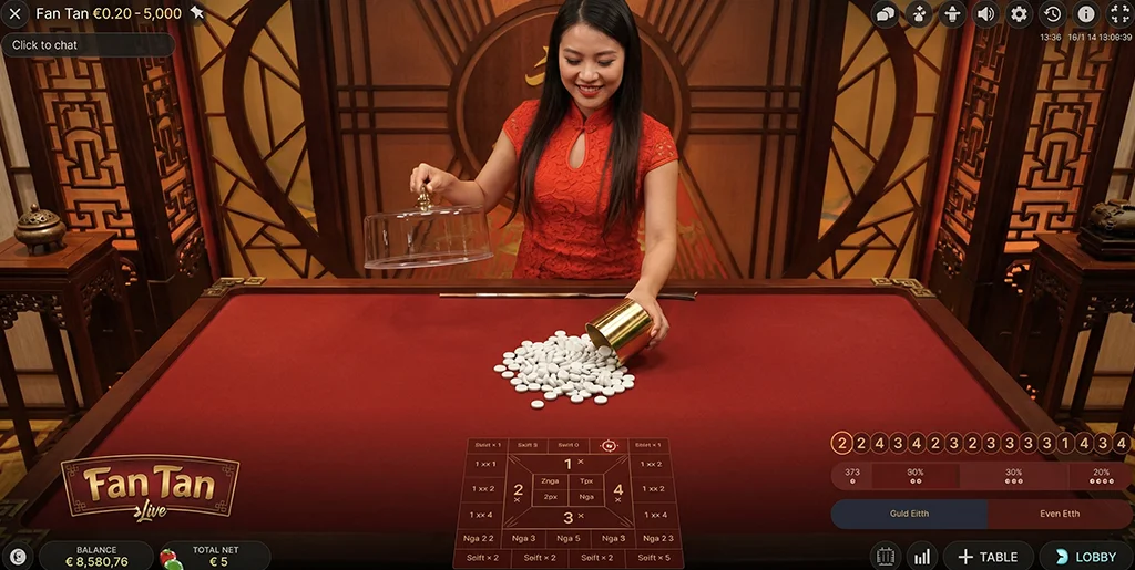 Live dealer separating beads in Fan Tan round